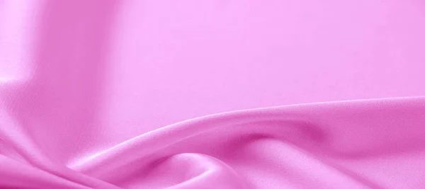 texture. Pink silk fabric. brilliant luster and characteristic