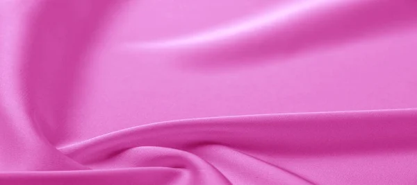 Textura. Tecido de seda rosa. brilho brilhante e característica — Fotografia de Stock