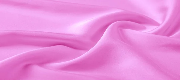 Textur. rosa Seidenstoff. brillanter Glanz und charakteristisch — Stockfoto
