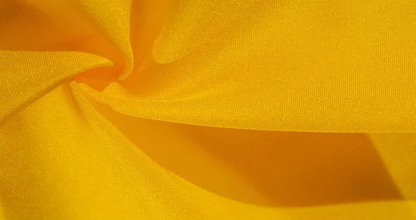 Padrão de fundo de textura, seda de tecido amarelo. Crepe de cetim o — Fotografia de Stock