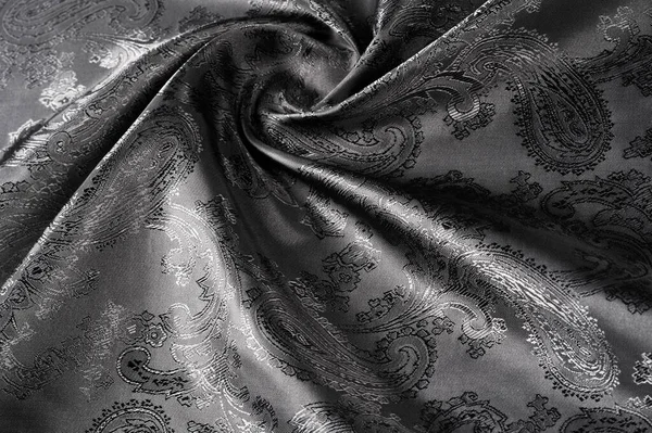 Texture, fond, tissu gris acier noir avec une patte paisley — Photo