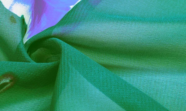 Textura, fondo, tejido de seda verde con un estampado floral azul . — Foto de Stock