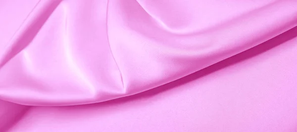 texture. Pink silk fabric. brilliant luster and characteristic