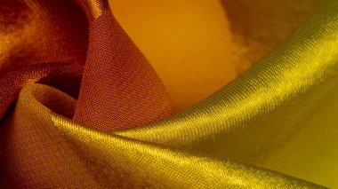 Doku, arka plan, metalik bir sarı ipek çizgili kumaş 