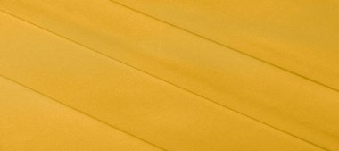 arka plan dokusu, desen. Sarı ipek kumaş. Çok hafif bir fa