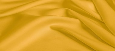 arka plan dokusu, desen. Sarı ipek kumaş. Çok hafif bir fa
