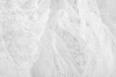 Bir un sayesinde bir örgü doku arka plan deseni beyaz kumaş