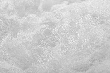 Bir un sayesinde bir örgü doku arka plan deseni beyaz kumaş