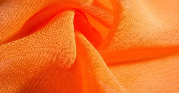 Fond, motif, texture, tissu de soie orange a un brillant — Photo