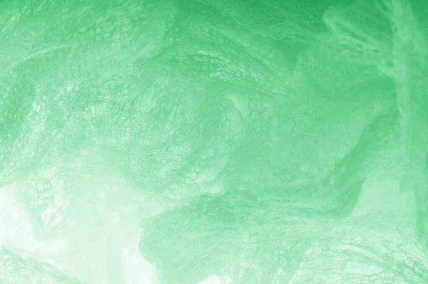 Cloth in a mesh green. Add a line of ethereal brilliance to your — Stock Photo, Image