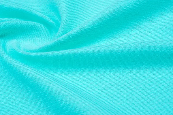 Tekstura, tło, wzór. Tkanina jest Dzianinowa niebieska, turkusowa — Zdjęcie stockowe