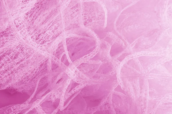 Fabric in a mesh of pink color. this is a micro-thin mesh, which