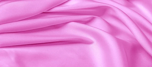 texture. Pink silk fabric. brilliant luster and characteristic