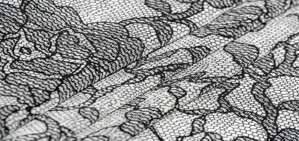 Textur, bakgrund, mönster. Sidenvitt tyg med spetsmönster — Stockfoto
