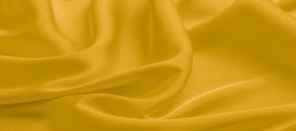 Background texture, pattern. Yellow silk fabric. A very light fa — Stock Photo, Image