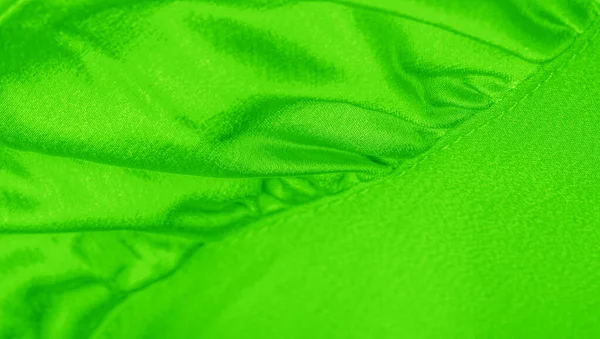 Diaper fabric with green texture. This versatile fabric has many — Stock Photo, Image