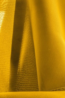 doku, arkaplan, desen. Altın sarısı ipek kumaş panoramik fotoğraf.