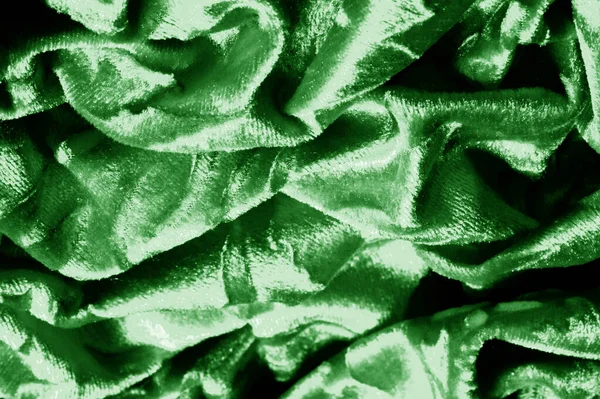 Samtgrün Samtmuster aus Samt unter einem unbeschnittenen Stoff geschnitzt — Stockfoto