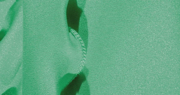 Текстура, фон, шелковая ткань, зеленая женская шаль Удобно — стоковое фото