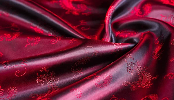 Texture, fabric, red silk with paisley pattern. This beautiful p