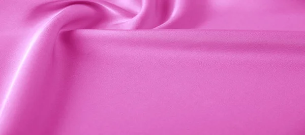 texture. Pink silk fabric. brilliant luster and characteristic