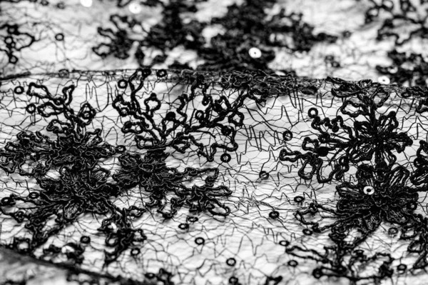 Texture, motif, tissu dentelle en noir sur fond blanc. Th h — Photo
