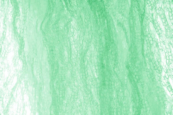 Cloth in a mesh green. Add a line of ethereal brilliance to your — Stock Photo, Image