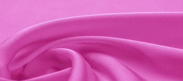 texture. Pink silk fabric. brilliant luster and characteristic