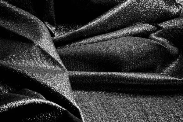 Textur, bakgrund, mönster. Tyg grå svart belagd med en met — Stockfoto