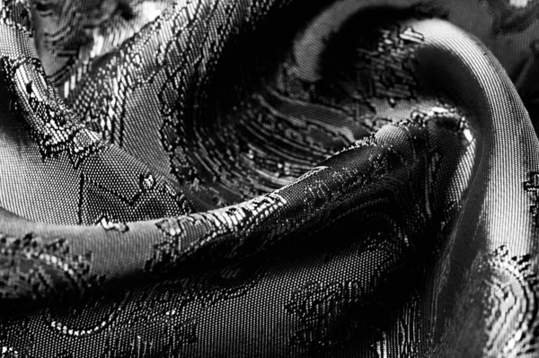 Textuur, achtergrond, zwarte stalen grijze stof met een Paisley Patt — Stockfoto