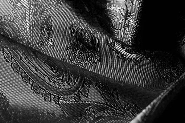 Texture, fond, tissu gris acier noir avec une patte paisley — Photo