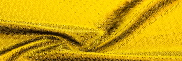 Background texture, pattern. Yellow, mustard silk fabric with a