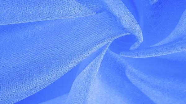 Textura, fondo, patrón, tela azul seda. Crepe satén en t — Foto de Stock