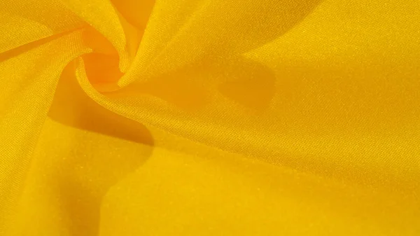 Текстура фонового візерунка, шовк жовтої тканини. Креп сатин о — стокове фото