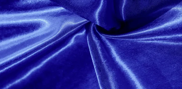 Текстура, фон, візерунок, шовкова тканина синім кольором. Це чарівне — стокове фото