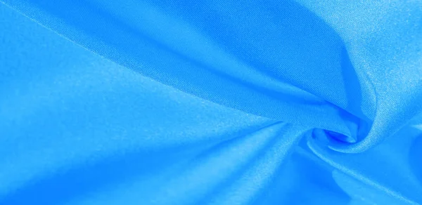 Текстура, фон, візерунок, шовкова тканина синім кольором. Цей шовк — стокове фото