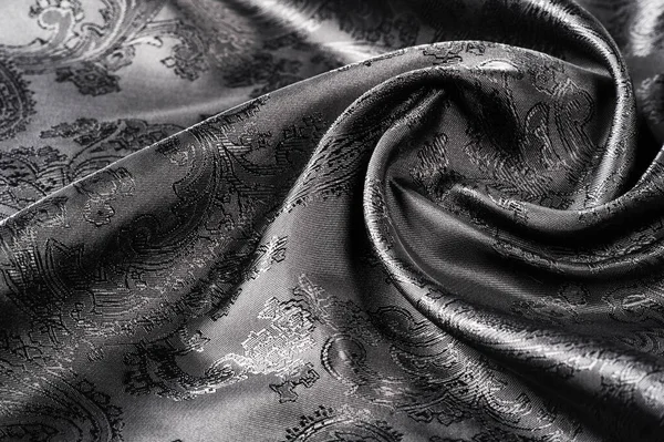 Textura, fondo, tela gris acero negro con un paisley patt — Foto de Stock