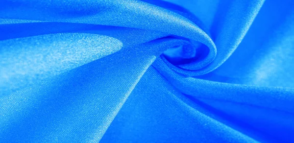 Textura, pozadí, vzorek, hedvábná látka v modrém. Toto hedvábí je — Stock fotografie