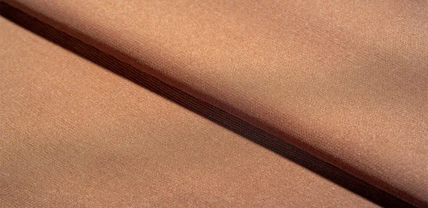 Texture de fond du tissu de soie. C'est une écharpe brune naturelle — Photo