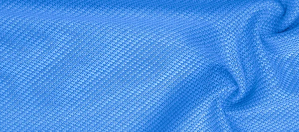 Tekstura tła, wzór tkanina ciepła wełna z haftem niebieskim — Zdjęcie stockowe