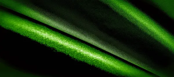 Textur, Hintergrund, Muster. Panoramafoto aus grünem Seidenstoff. — Stockfoto