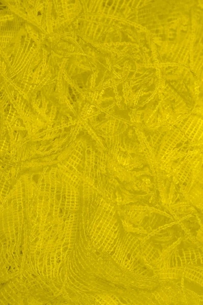 Textura, fundo, padrão. tule amarelo. Com um design simples — Fotografia de Stock