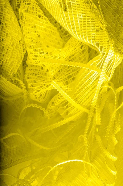 Textura, fondo, patrón. tul amarillo. Con un diseño sencillo — Foto de Stock