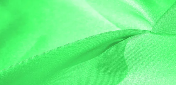 Текстура, фон, узор, шелковая ткань зеленого цвета. This s — стоковое фото
