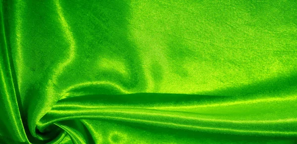 Textuur, achtergrond, patroon, zijde stof van groene kleur. Dit een — Stockfoto