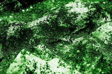 Doku, desen, beyaz bir arka plan üzerinde yeşil dantel kumaş. Th