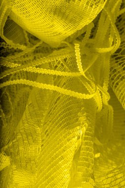 Doku, arka plan, desen. sarı tül. Basit bir tasarıma sahip