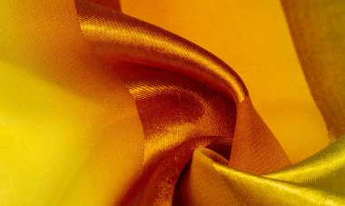 Doku, arka plan, metalik bir sarı ipek çizgili kumaş 