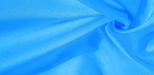 Textur, bakgrund, mönster, sidentyg i blått. Detta silke är — Stockfoto