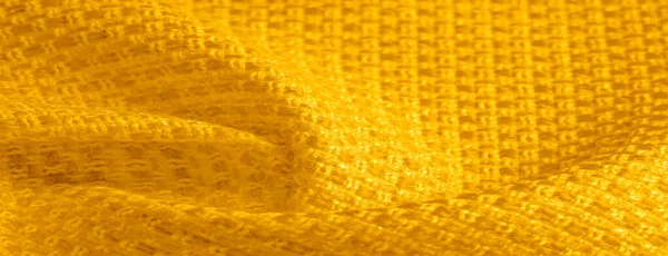 Textura de fondo, patrón. Tela amarilla con lentejuelas metálicas — Foto de Stock